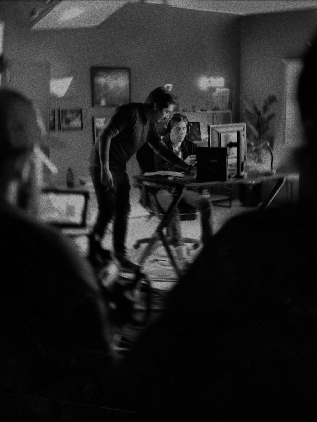 Shooting a scene in an office, seen through the crew